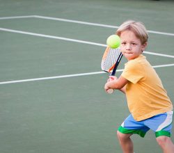 "Determined three year old keeps his eye on the tennis ball as he swings. Turns out this little guyhas great eye-hand coordination for a pre-schooler. Fun to photograph because he was so focused and was having so much fun.For similar and newly added tennis images, please visit my Tennis Anyone lightbox."